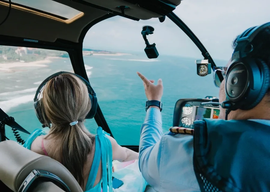 View from a helicopter cockpit over the Bali coastline